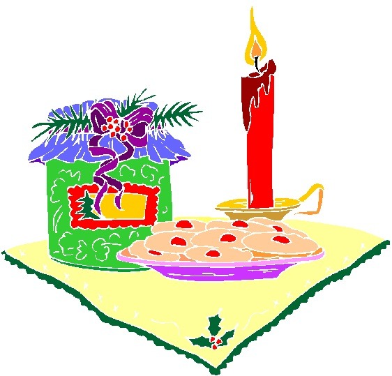 Festive Christmas candle, cookies, and gift on a green-bordered cloth.