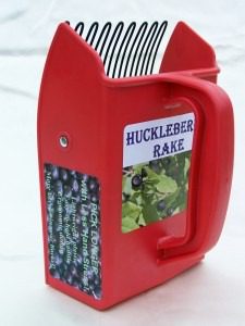 Red Huckleber Rake container with a handle and plant-themed label.