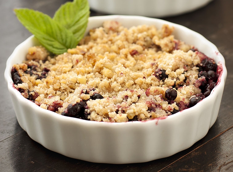 Close-up of a freshly baked berry crumble dessert.