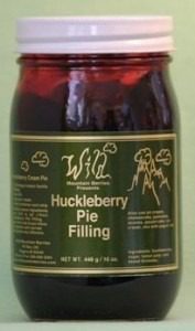 A jar of Wild Huckleberry Pie Filling with a dark berry content.