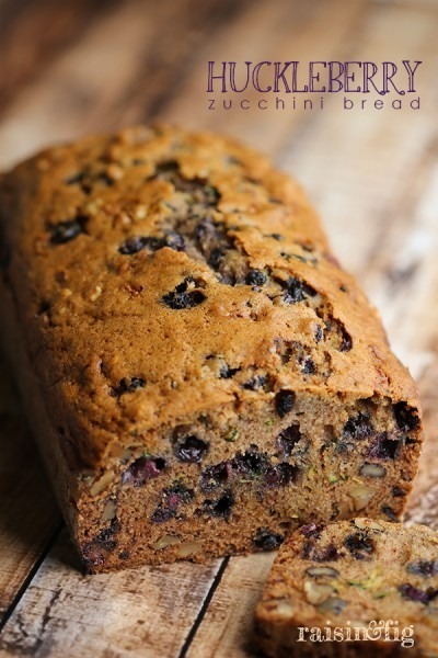 Freshly baked blueberry bread loaf with a golden crust.