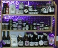 Shelves filled with jars and bottles of various preserves and sauces.