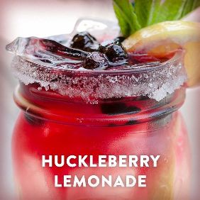 Huckleberry lemonade in a glass jar.