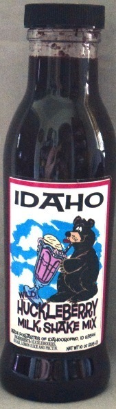A bottle label featuring a bear playing drums with the word "IDAHO".
