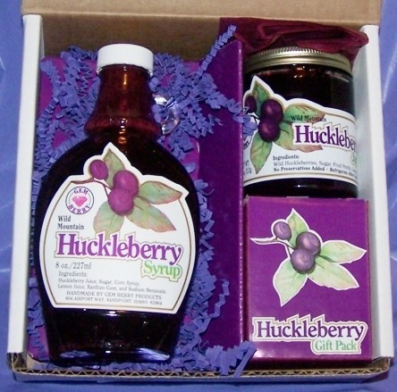 A gift box with huckleberry syrup and two huckleberry jam jars.