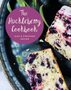 Huckleberry cookbook with berry cake slice.